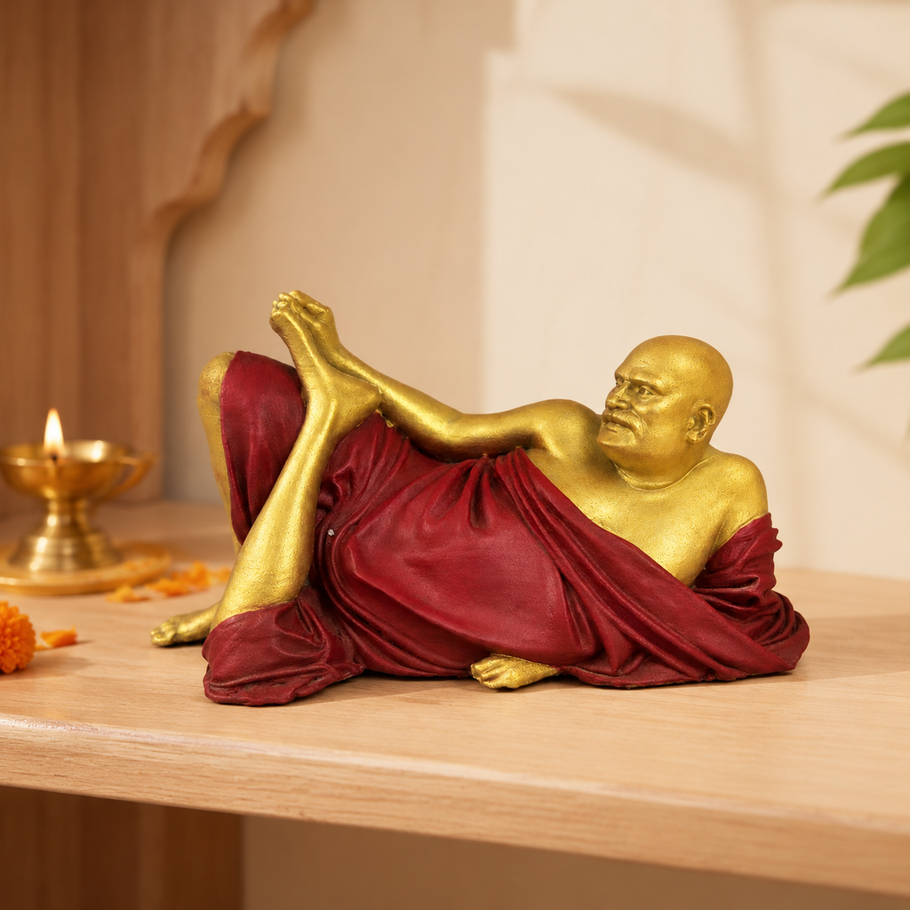 Neem Karoli Baba statue displayed on a devotional shelf