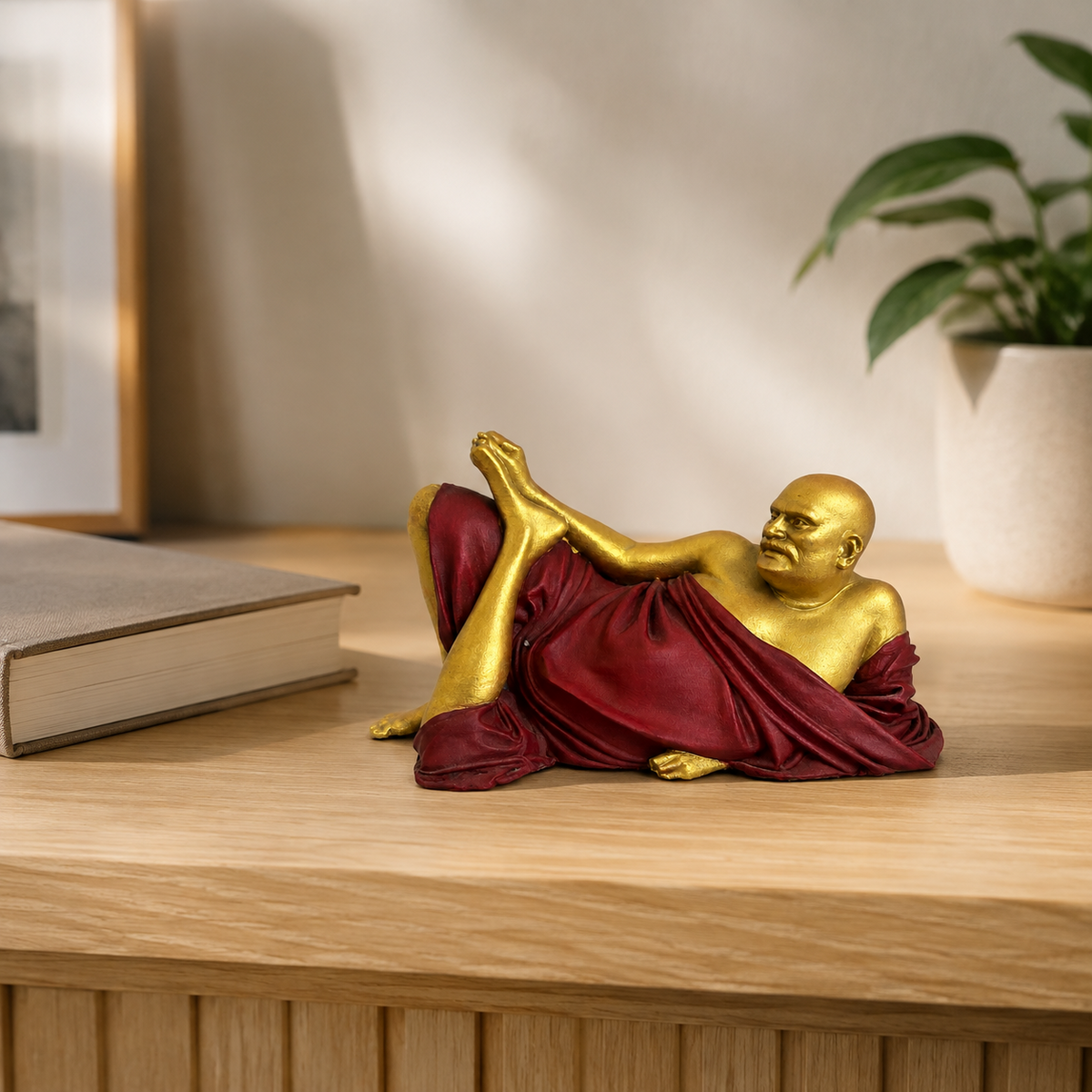Neem Karoli Baba statue displayed on a desk