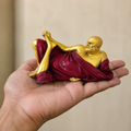 Neem Karoli Baba miniature statue held in a hand